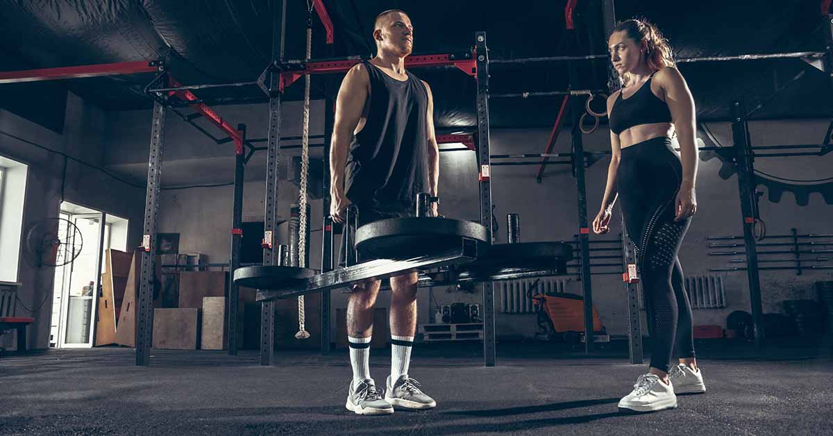 Couple training with Weight Training Equipment