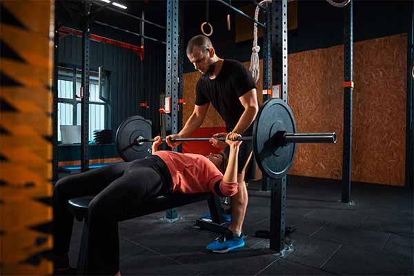 Woman doing exercise using dumbbells 
