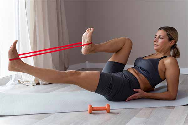 Woman doing exercise with resistance bands 