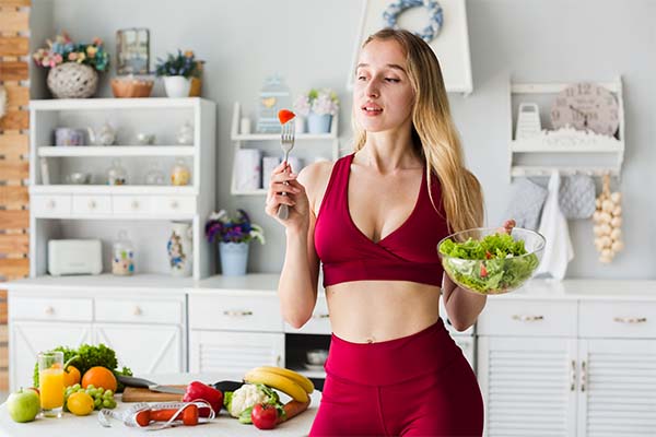 sporty woman in kitchen