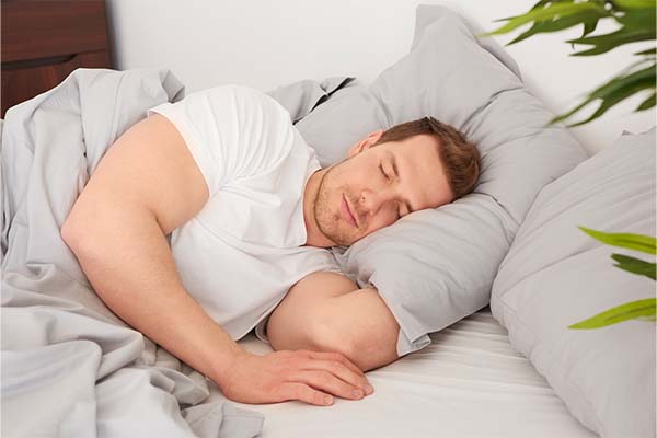 Man sleeping on bed