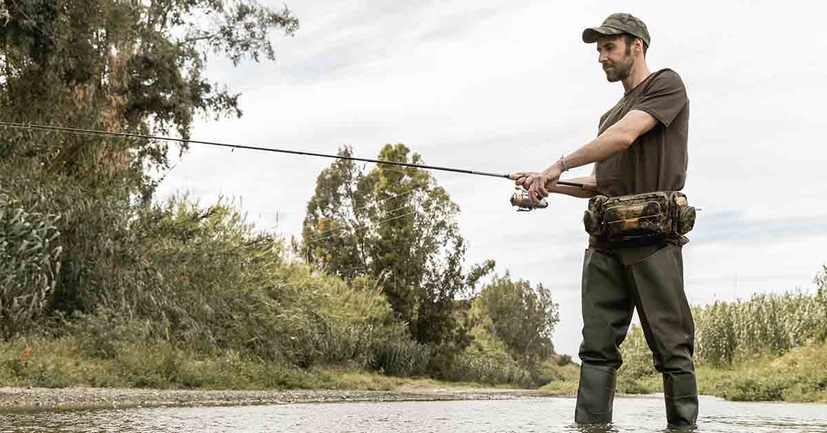 Man fishing at the river using fishing gear