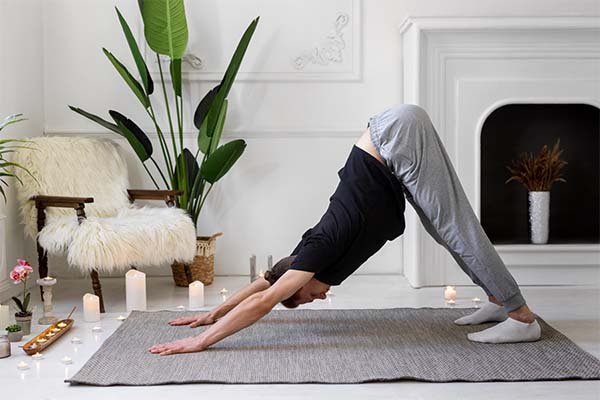 man doing yoga on mat