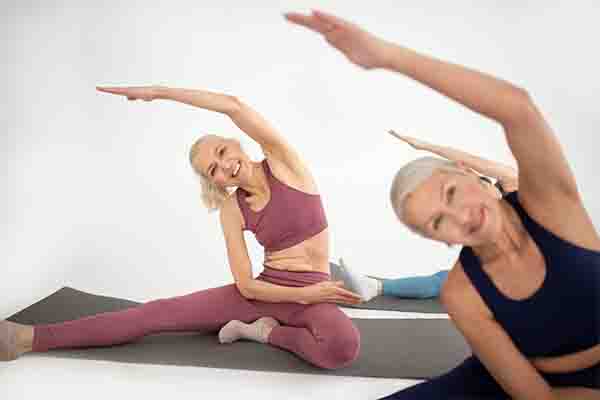 Fitness Tips for Older Adults to Stay Active and Healthy: Older women doing yoga