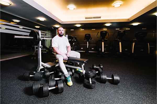 Bearded man on bench press machine
