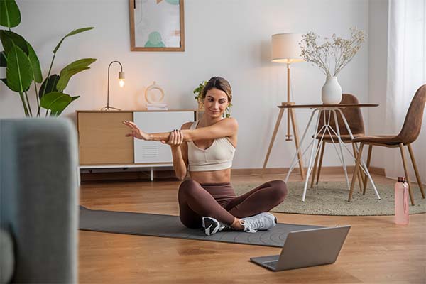 Woman doing stretching to improve sleep quality  