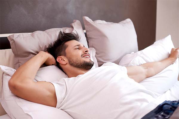 Sleep quality: Man lying on bed