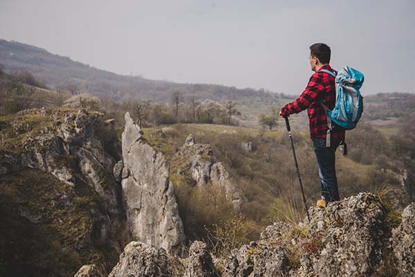 rambler with backpack enjoying nature