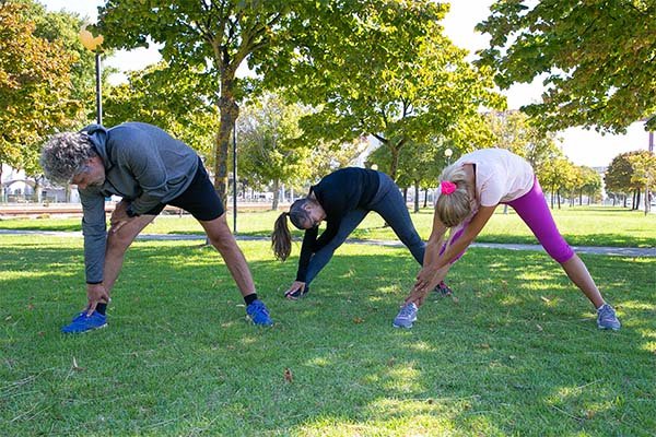 people doing morning exercise in park