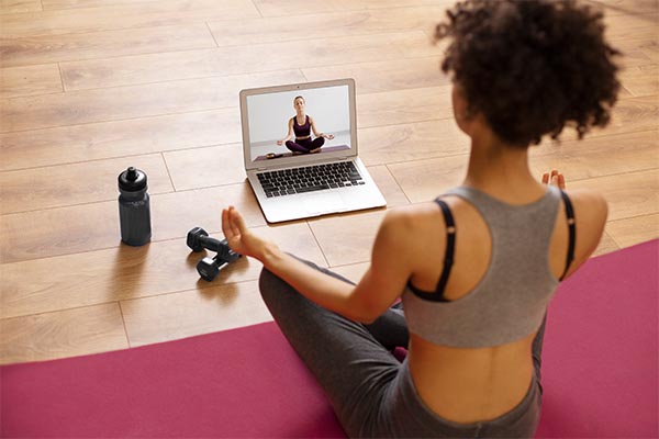 Woman doing yoga online