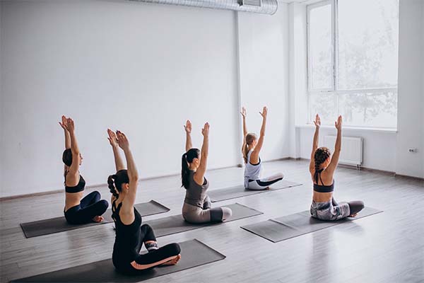 A group of women doing yoga 