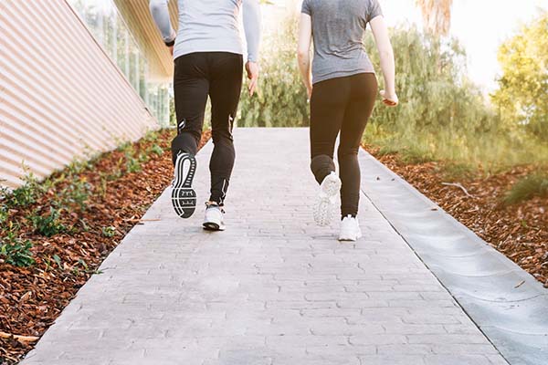 Man and woman walking backwards