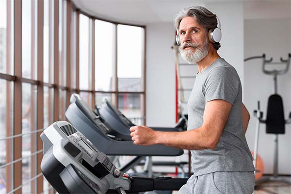 man at gym on treadmill