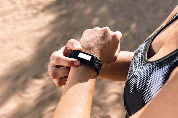 woman using fitness tracker