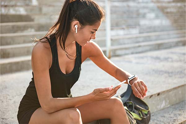 Woman using fitband