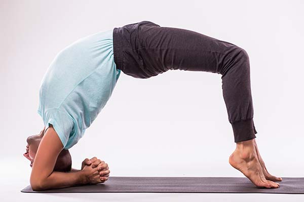 Wall-Supported Bridge Pose