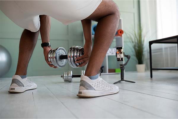 man training with dumbbell