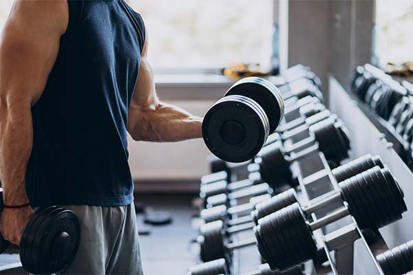 Strong man training in gym