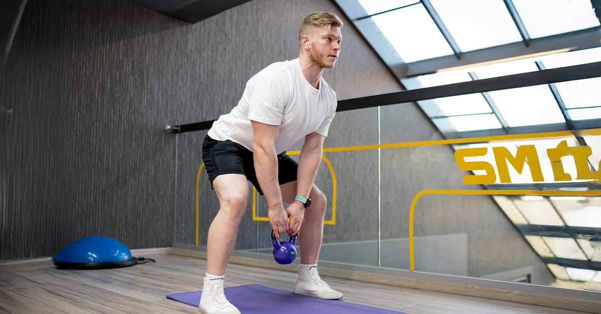 man working out with kettlebell