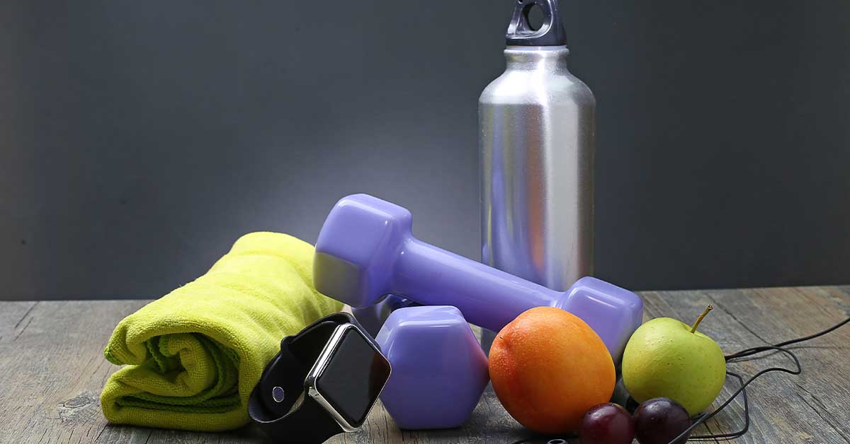 Healthy lifestyle dumbbell smart watch and fruit