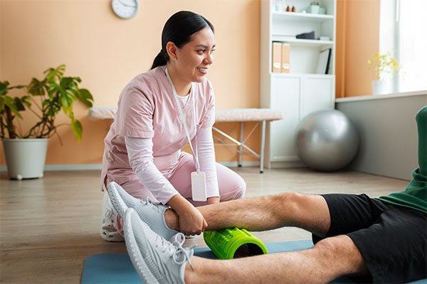 Doctor helping patient during rehabilitation