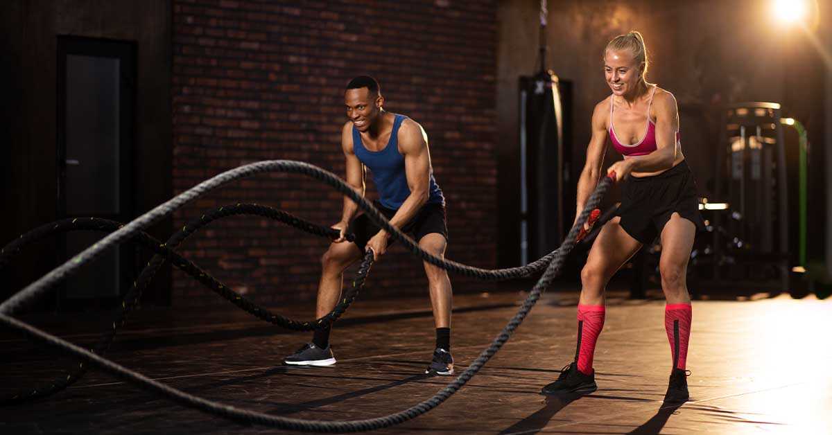 man and woman cross-training together
