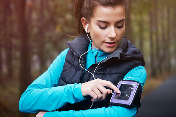 Woman using a fitness tracker for jogging
